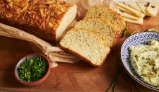 A closeup shot of cheese bread on a wooden table